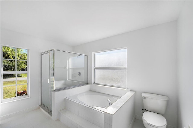 full bathroom with plenty of natural light, toilet, a stall shower, and a bath