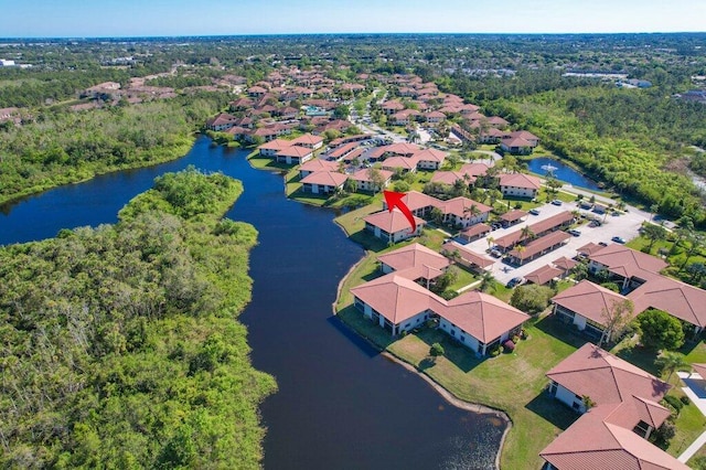 aerial view with a residential view and a water view