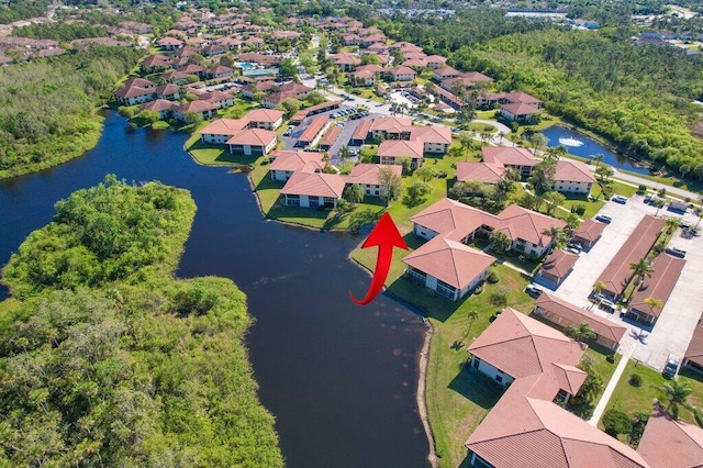 bird's eye view with a residential view and a water view