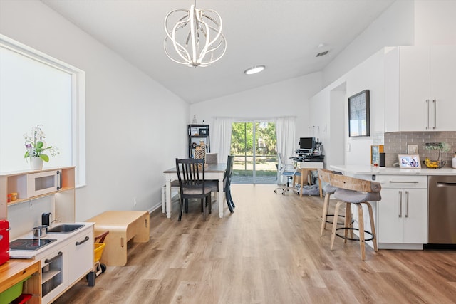 kitchen with light wood-style floors, dishwasher, white cabinets, and light countertops