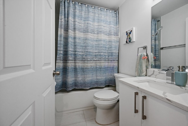 full bath with tile patterned flooring, toilet, vanity, and shower / bath combo