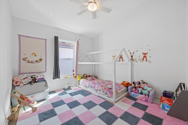 bedroom with baseboards, carpet flooring, a ceiling fan, and lofted ceiling