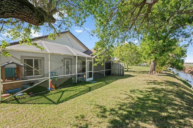 view of yard featuring glass enclosure