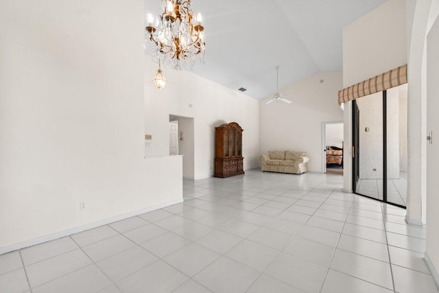 unfurnished living room with tile patterned flooring, ceiling fan with notable chandelier, high vaulted ceiling, and baseboards