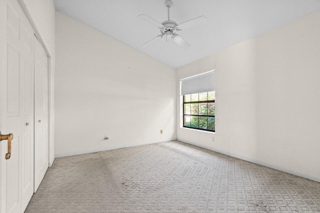 empty room featuring carpet flooring, a ceiling fan, and baseboards