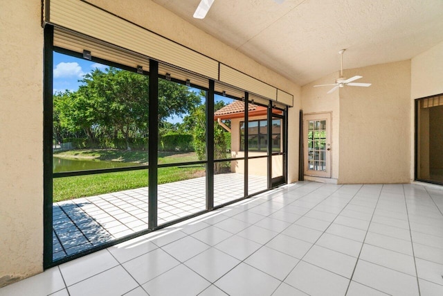 unfurnished sunroom featuring vaulted ceiling and ceiling fan