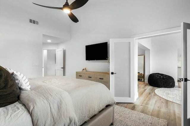 bedroom with visible vents, ceiling fan, and light wood-style floors