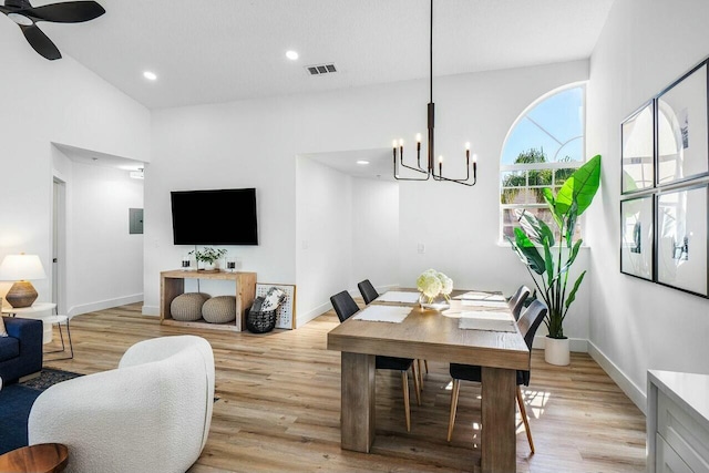 dining room featuring light wood-type flooring, visible vents, baseboards, and recessed lighting