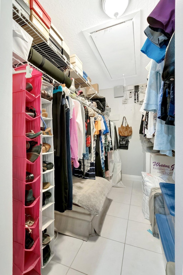 spacious closet featuring tile patterned floors