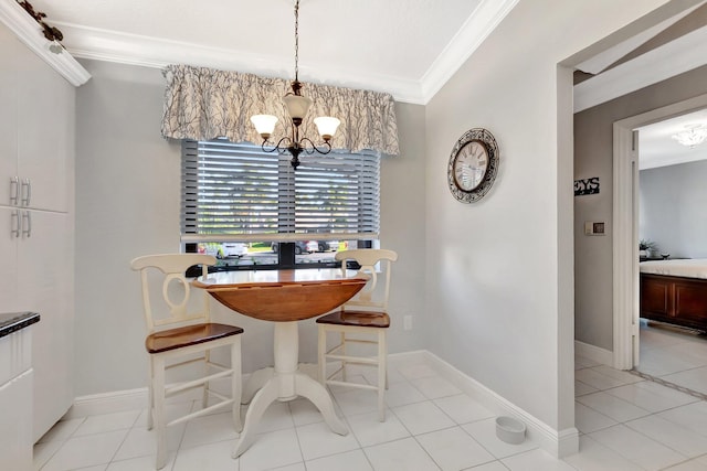 dining area with a chandelier, crown molding, baseboards, and light tile patterned flooring