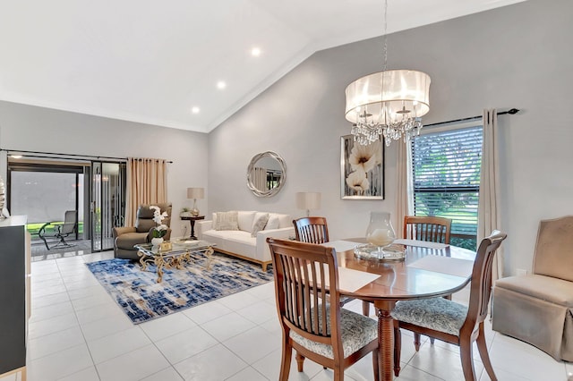 dining space with ornamental molding, high vaulted ceiling, light tile patterned floors, and a chandelier