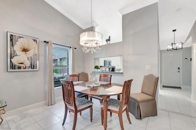 dining space with baseboards, high vaulted ceiling, light tile patterned flooring, ornamental molding, and a notable chandelier