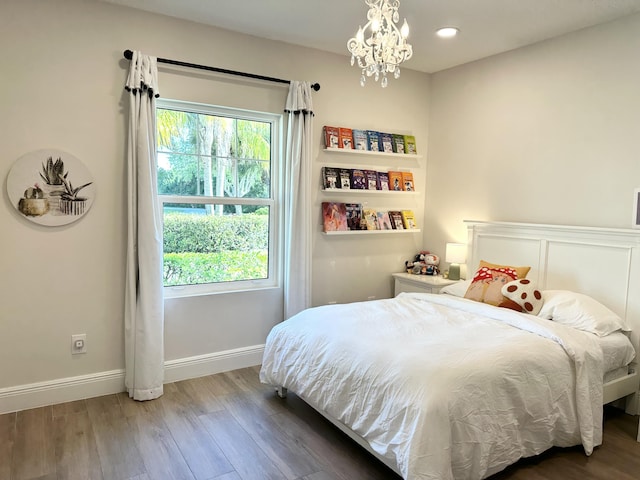 bedroom featuring recessed lighting, multiple windows, wood finished floors, and baseboards