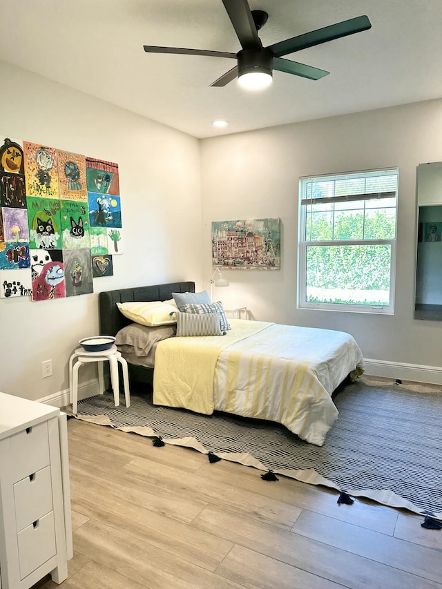 bedroom featuring recessed lighting, a ceiling fan, baseboards, and light wood finished floors