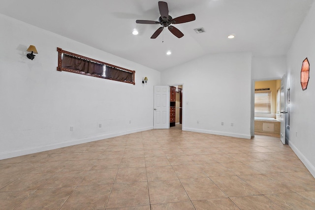 unfurnished room with visible vents, ceiling fan, baseboards, vaulted ceiling, and light tile patterned flooring