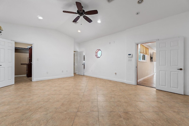 unfurnished bedroom featuring lofted ceiling, light tile patterned flooring, recessed lighting, and baseboards