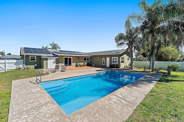 view of pool featuring a yard, a patio area, a fenced backyard, and a fenced in pool