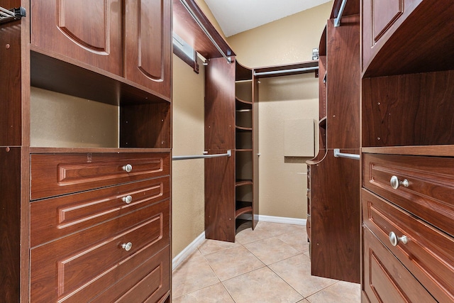 walk in closet featuring light tile patterned floors