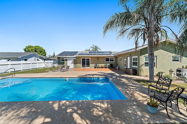 view of swimming pool with a patio area, a fenced in pool, and a fenced backyard