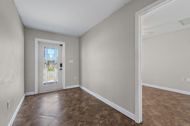 foyer entrance featuring visible vents and baseboards