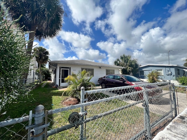 view of front of home featuring stucco siding and fence