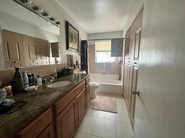 bathroom featuring toilet, backsplash, tile patterned flooring, shower / bath combination with curtain, and vanity