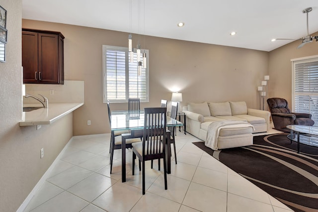 dining room featuring light tile patterned floors, recessed lighting, and baseboards