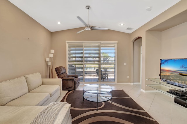 living room with visible vents, arched walkways, light tile patterned floors, lofted ceiling, and ceiling fan