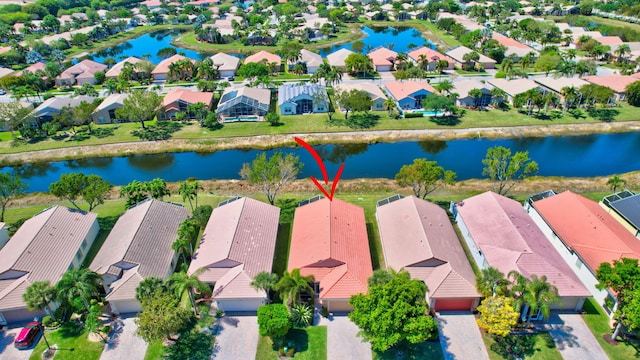 aerial view with a residential view and a water view