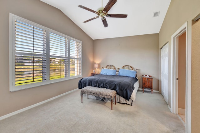 bedroom with carpet, visible vents, baseboards, lofted ceiling, and ceiling fan