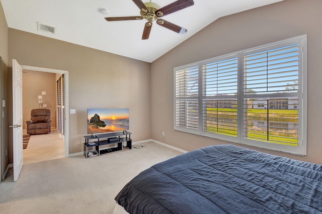 bedroom featuring visible vents, lofted ceiling, a ceiling fan, carpet floors, and baseboards