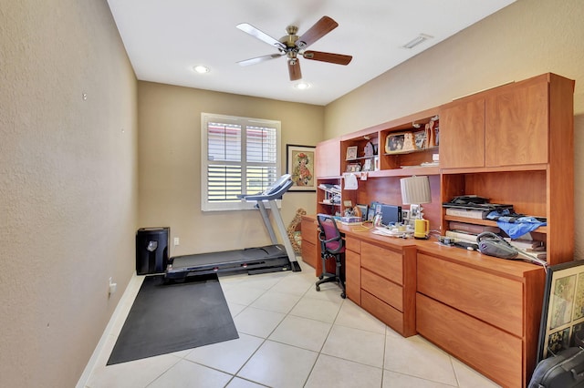 office featuring light tile patterned flooring, visible vents, baseboards, and ceiling fan