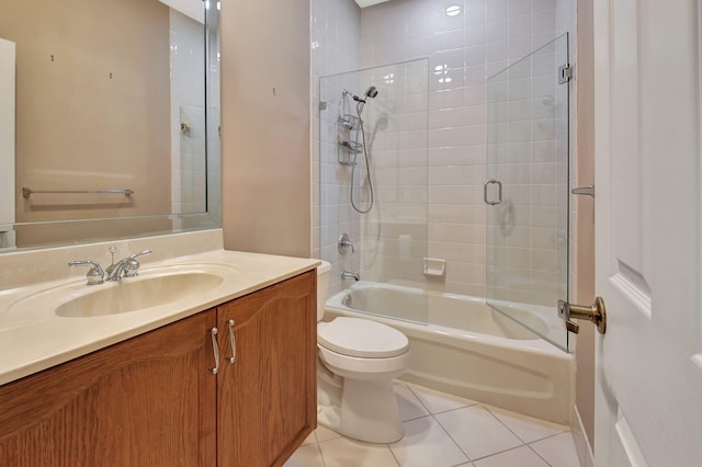 full bath with tile patterned floors, toilet, vanity, and shower / tub combination