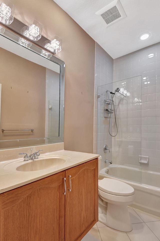 bathroom featuring vanity, visible vents, tub / shower combination, tile patterned flooring, and toilet