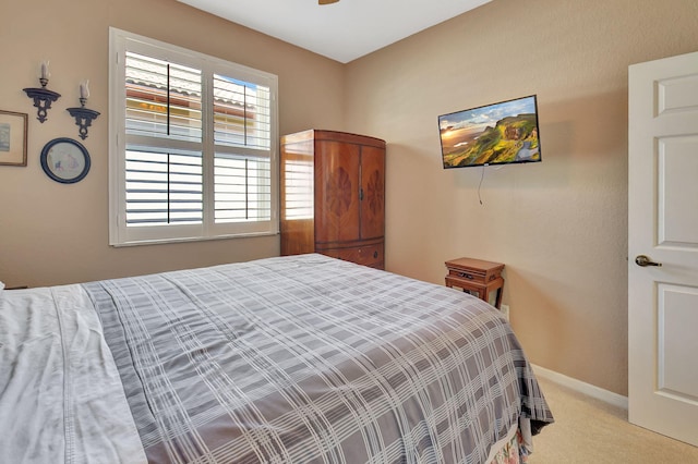 bedroom with baseboards and carpet flooring