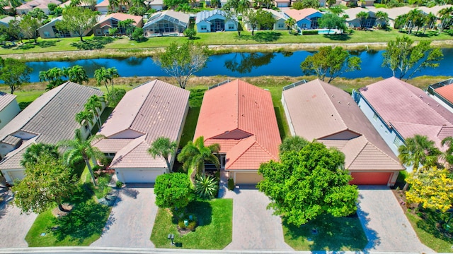 birds eye view of property featuring a residential view and a water view