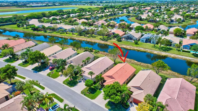 aerial view featuring a residential view and a water view