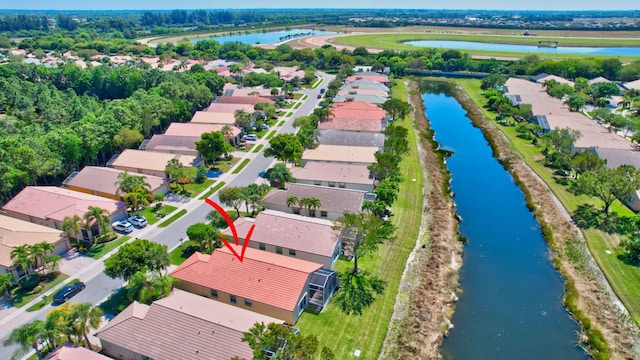 aerial view featuring a residential view and a water view