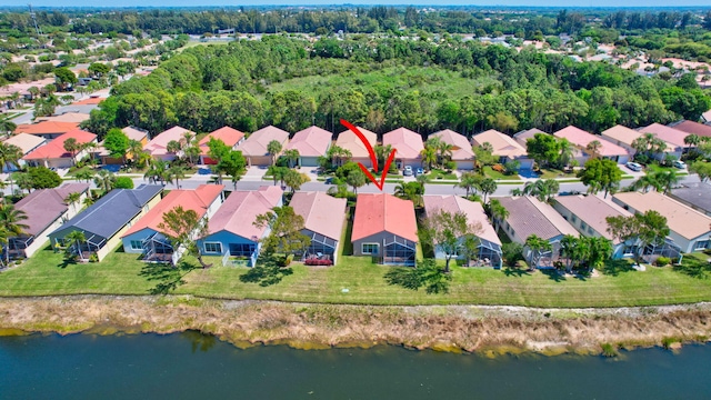 aerial view with a residential view and a water view