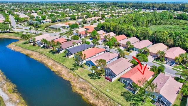 aerial view featuring a residential view and a water view