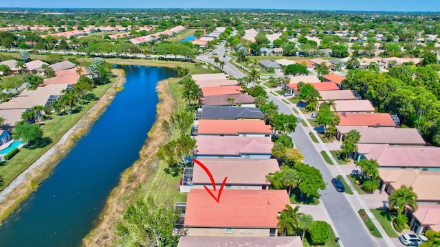 bird's eye view with a residential view and a water view