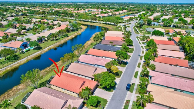 aerial view featuring a residential view and a water view