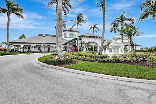 view of property featuring curved driveway