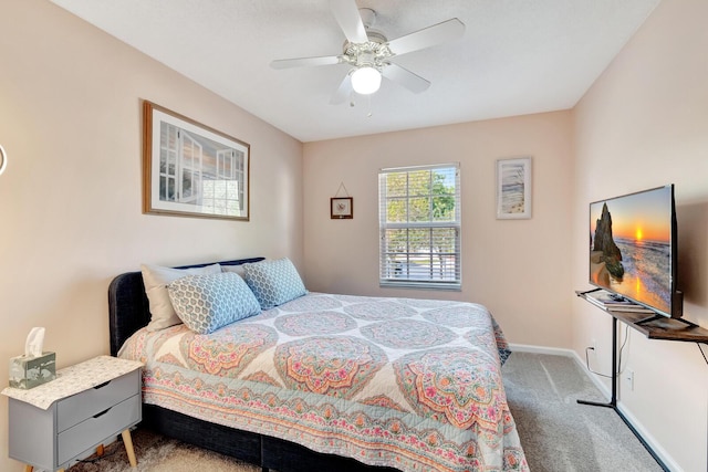 carpeted bedroom featuring baseboards and ceiling fan