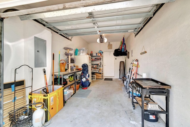 garage featuring electric panel and a garage door opener