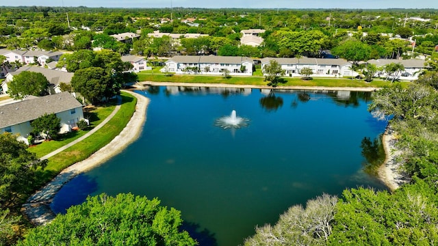 drone / aerial view with a water view and a residential view