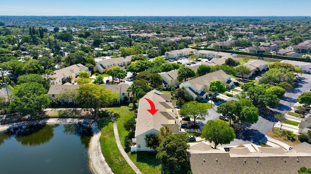 bird's eye view with a residential view and a water view