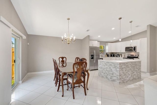 dining room with visible vents, lofted ceiling, an inviting chandelier, and light tile patterned flooring