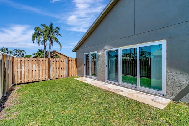 view of yard with a fenced backyard