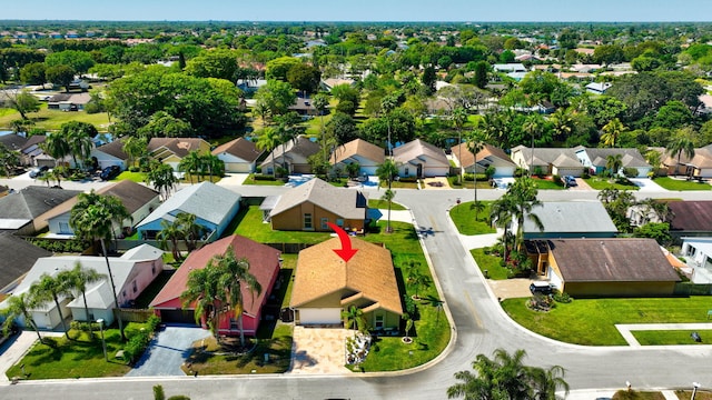 birds eye view of property with a residential view